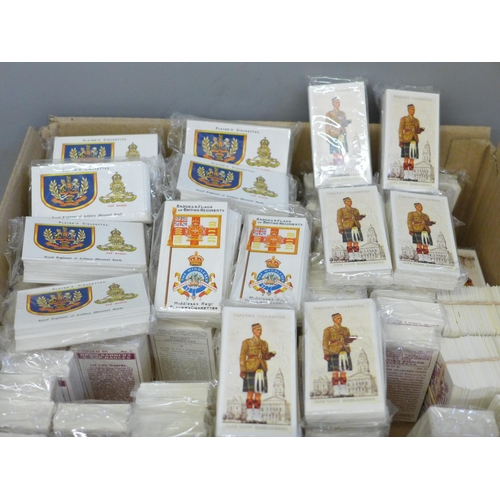 740 - A box of 81 John Players complete sealed reproduction cigarette card sets, 25 full sets of Badges an... 