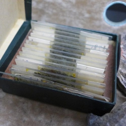 764 - A box of mineral samples, microscope slides and two test tubes