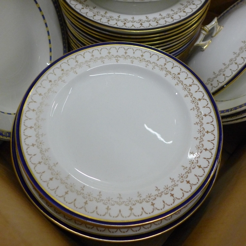 778 - A Royal Crown Derby part dinner service, plates and soup bowls, two medium oval tureens, 36 pieces a... 