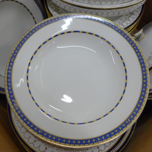 778 - A Royal Crown Derby part dinner service, plates and soup bowls, two medium oval tureens, 36 pieces a... 