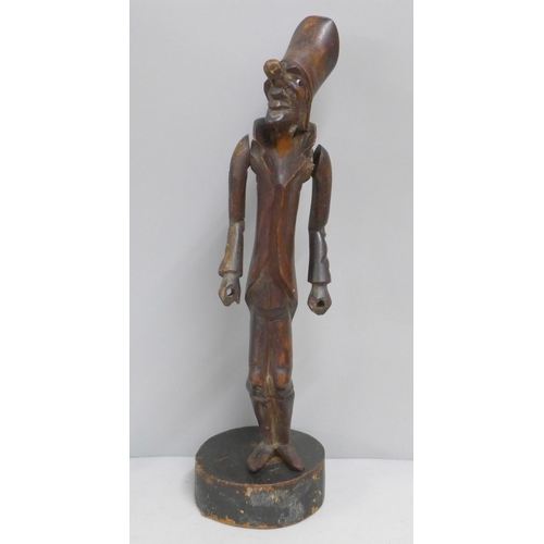 785 - A carved wooden figural pipe and stand, a/f, one eye missing, 41cm