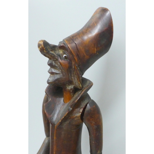 785 - A carved wooden figural pipe and stand, a/f, one eye missing, 41cm