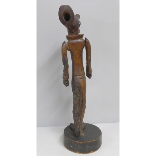 785 - A carved wooden figural pipe and stand, a/f, one eye missing, 41cm