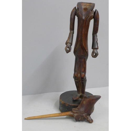 785 - A carved wooden figural pipe and stand, a/f, one eye missing, 41cm