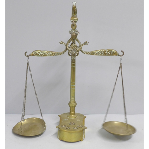 786 - A set of brass balance scales and weights, two weights missing