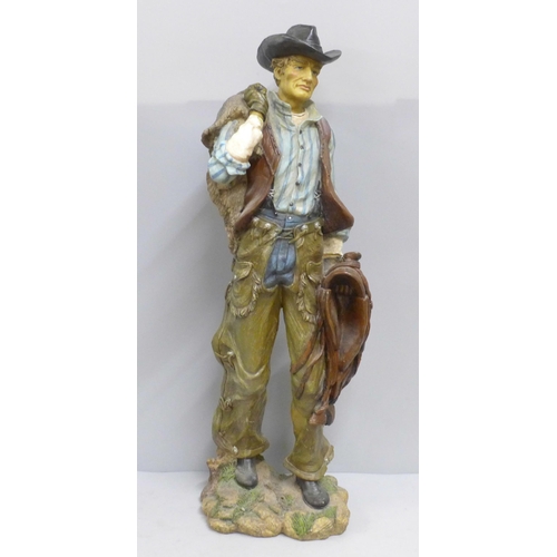 788 - A resin model of a cowboy, 53cm