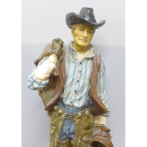 788 - A resin model of a cowboy, 53cm