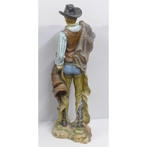 788 - A resin model of a cowboy, 53cm