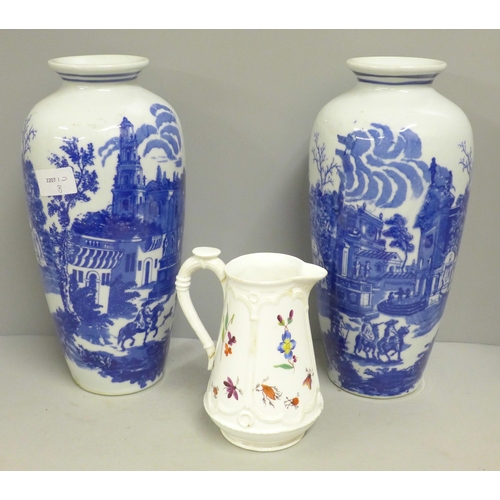 790 - A pair of blue and white vases and a pottery jug