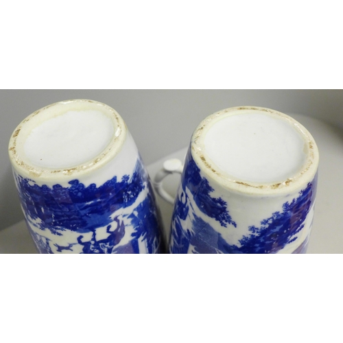 790 - A pair of blue and white vases and a pottery jug