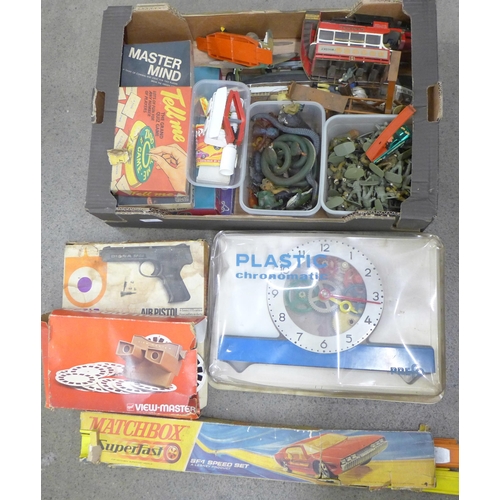 798 - A box of toys, games, models from 1960s onwards including plastic soldiers, rubber animals and snake... 