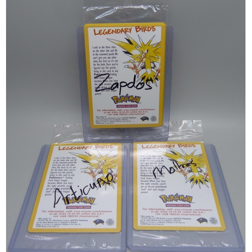 813 - Three sealed vintage Pokemon cards, Moltres, Zapdos, Articuno