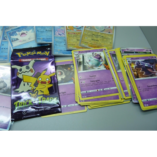 822 - Fifty holographic and trick or trade cards