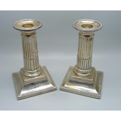 835 - A pair of silver Corinthian column candlesticks, George Howson, Sheffield 1898, 13cm