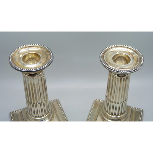 835 - A pair of silver Corinthian column candlesticks, George Howson, Sheffield 1898, 13cm