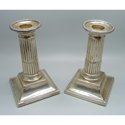 835 - A pair of silver Corinthian column candlesticks, George Howson, Sheffield 1898, 13cm