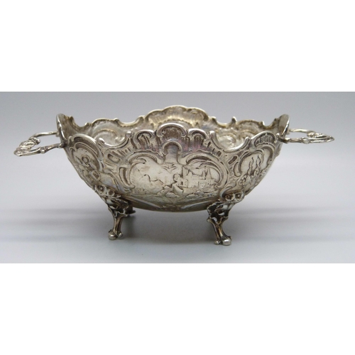 837 - An embossed two handle German 800 silver dish, 108g