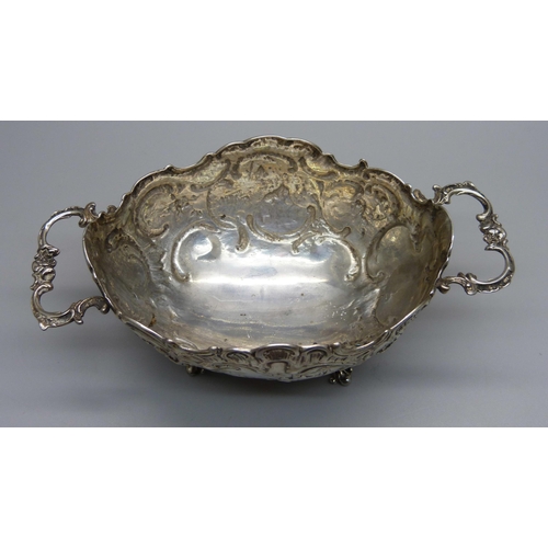 837 - An embossed two handle German 800 silver dish, 108g