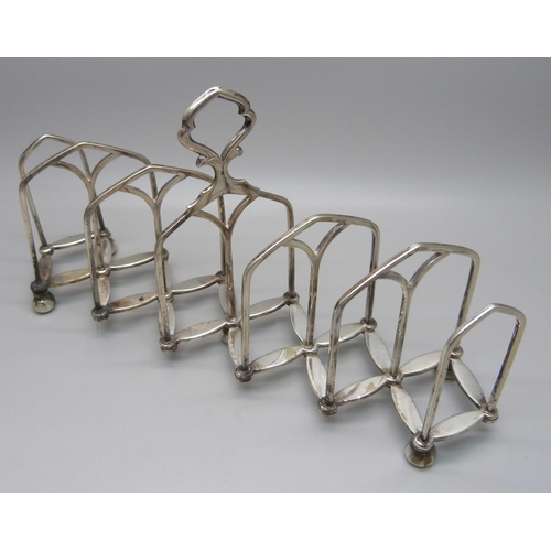 839 - A silver toast rack, Birmingham 1921, 41g, and a plated extending toast rack