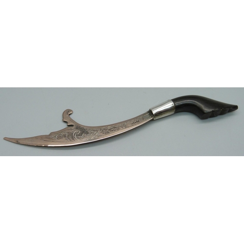 855 - An Eastern letter opener with carved horn handle, 13cm