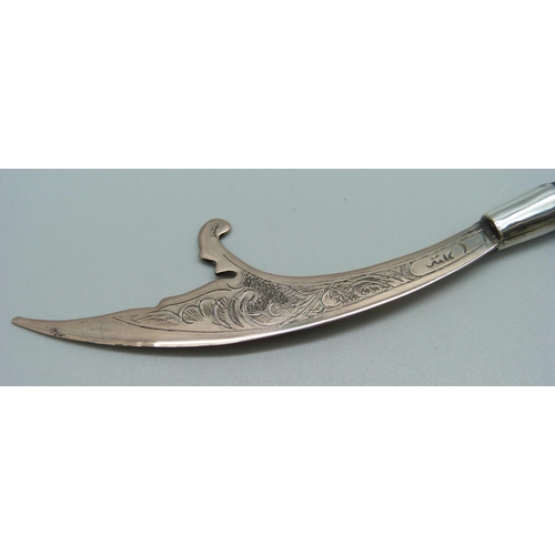 855 - An Eastern letter opener with carved horn handle, 13cm