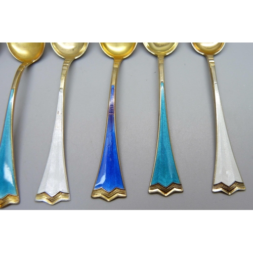 858 - A set of six silver gilt and enamel coffee spoons, stamped 925S, enamel a/f on one white and one roy... 