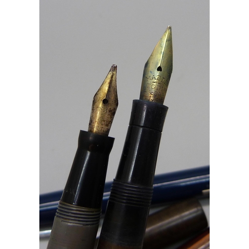 870 - A Swan pen with 14ct gold nib and seven other pens