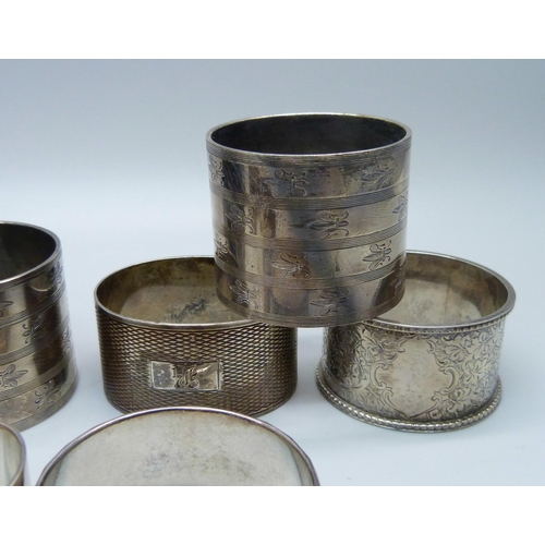 872 - Ten silver napkin rings including two pairs, 339g