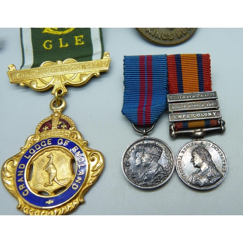 884 - A 14th King's Hussars badge, an Africa Service Medal to 211637 J. Wright, two miniature medals and a... 