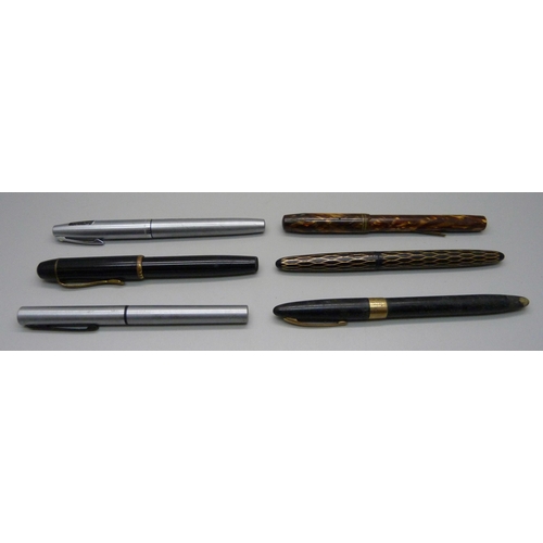 890 - A Waterman Skywriter pen with 14ct gold nib, lacking clip, four Sheaffer pens and a Tropen Scholar p... 