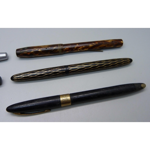 890 - A Waterman Skywriter pen with 14ct gold nib, lacking clip, four Sheaffer pens and a Tropen Scholar p... 