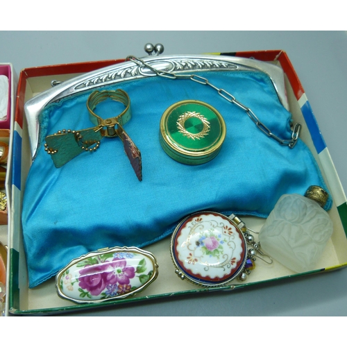 893 - A collection of vintage compacts, a scent bottle, clip-on earrings and a bag