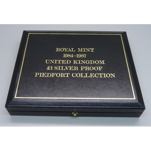 907 - A Royal Mint 1984/87 United Kingdom £1 Silver Proof Piedfort Collection