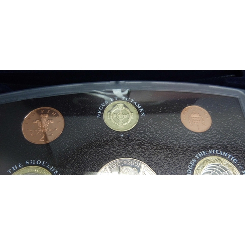 908 - A 1984 Olympics USA silver dollar proof quality and a 2001 United Kingdom proof set 'Glimpses of the... 