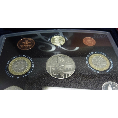 908 - A 1984 Olympics USA silver dollar proof quality and a 2001 United Kingdom proof set 'Glimpses of the... 