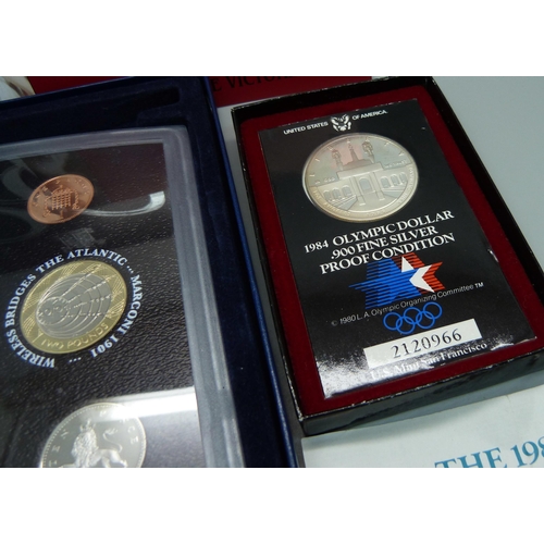 908 - A 1984 Olympics USA silver dollar proof quality and a 2001 United Kingdom proof set 'Glimpses of the... 