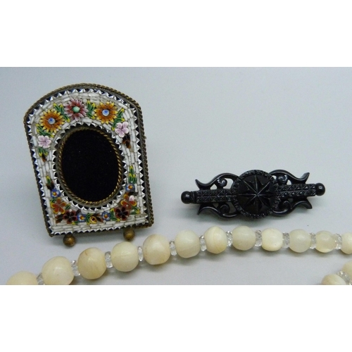 930 - A mico-mosaic picture frame, a gold stone brooch, mother of pearl necklace and vintage jewellery