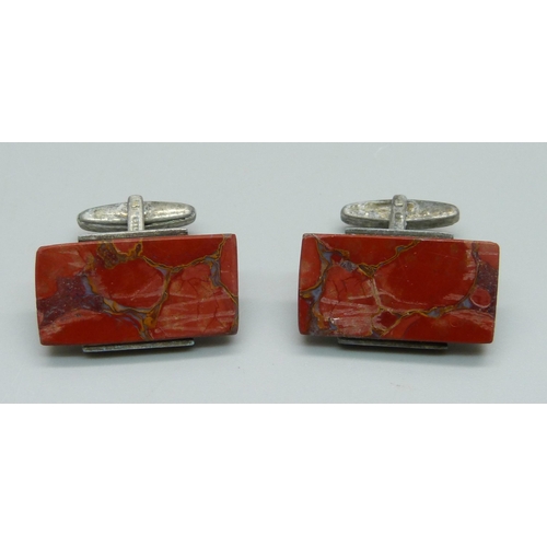 935 - A pair of agate cufflinks, stamped silver, a/f