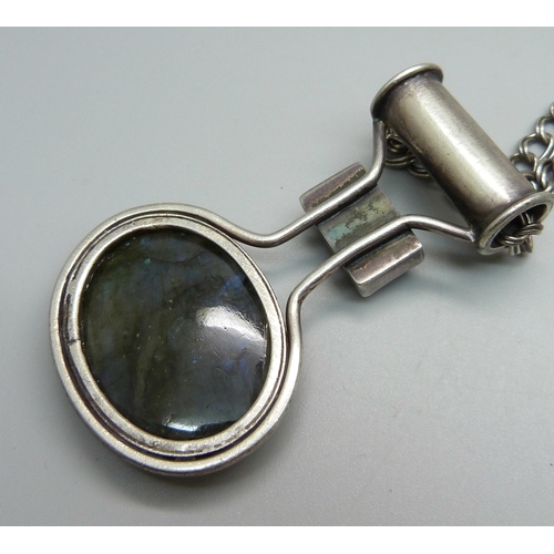 944 - An Arts and Crafts labradorite set pendant with 925 silver chain, pendant tests as silver, chain 43c... 