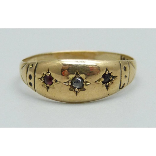 954 - A c1900 yellow metal, diamond and garnet ring, 1.7g, O