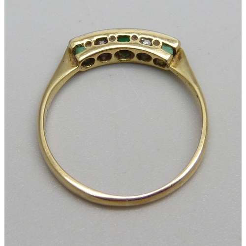 965 - An 18ct gold and five stone Art Deco ring, set with two diamonds, two emeralds and a replacement gre... 