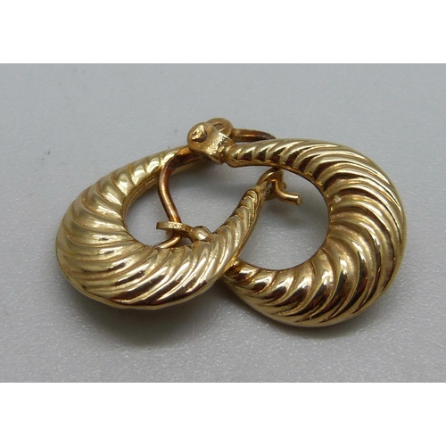 973 - A pair of 9ct gold earrings, 0.7g