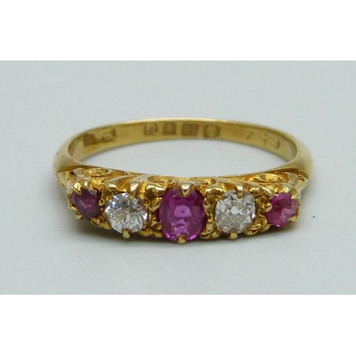 977 - An 18ct gold, ruby and diamond ring, 2.5g, K, one red stone possibly a replacement