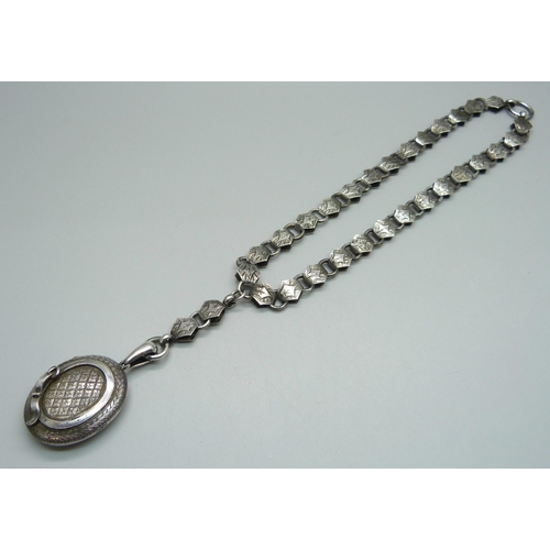 978 - A Victorian white metal locket and collar, locket 31mm wide