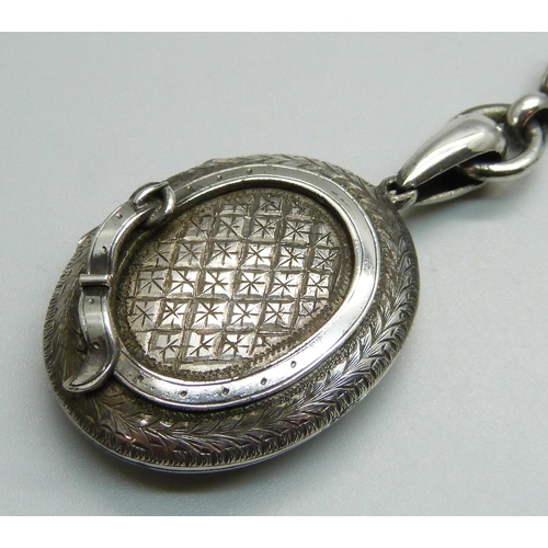 978 - A Victorian white metal locket and collar, locket 31mm wide