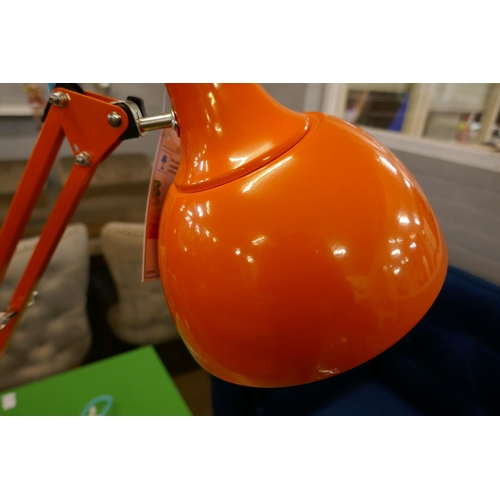 1324 - A shiny orange anglepoise lamp