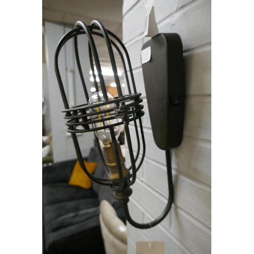 1425 - An industrial style battery operated wall lamp