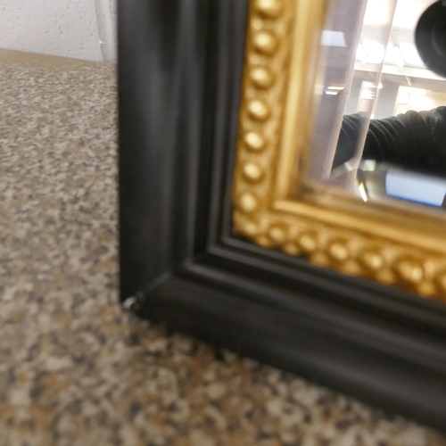 1450 - A black and gold overmantel mirror