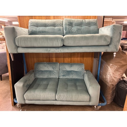 1612 - A pale blue velvet three seater sofa and two seater sofa(sun damaged)