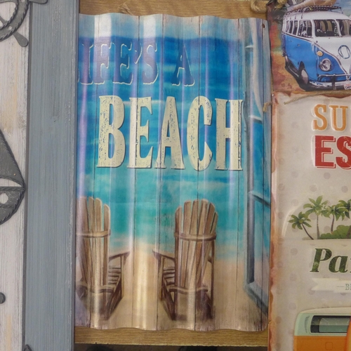 2064 - A collection of five beach themed wall art